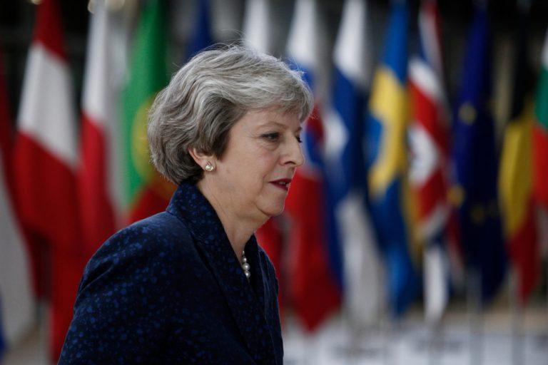 Theresa May defends Brexit deal, pound falls