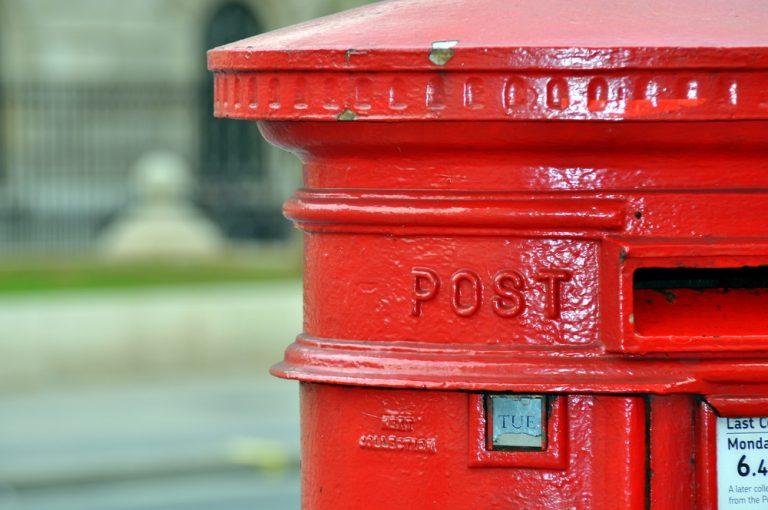 Royal Mail rebases dividend with profits at lower end of guidance