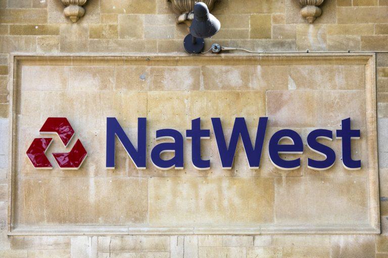NatWest beats forecasts and returns to profit