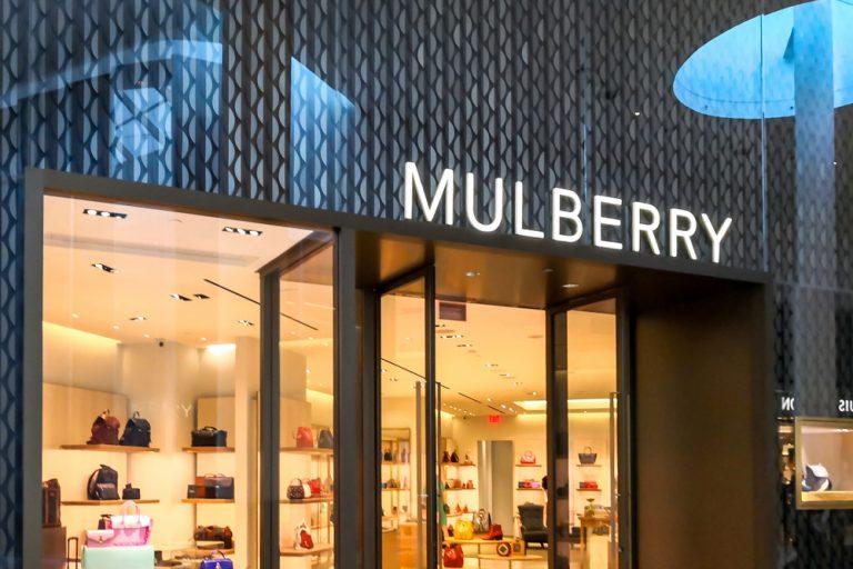 Mulberry narrows loss, shares rise