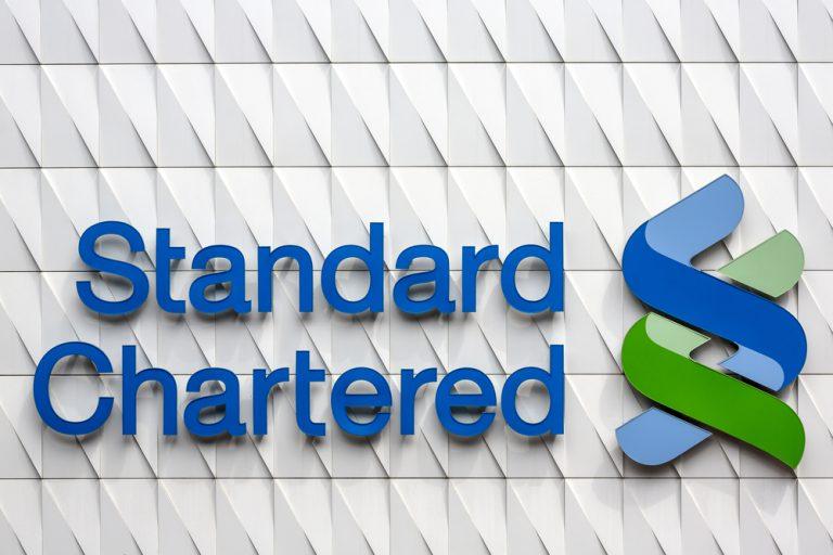 Standard Chartered to reinstate dividend despite fall in profit