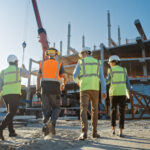 Diverse,Team,Of,Specialists,Inspect,Commercial,,Industrial,Building,Construction,Site.