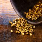 Profit,,Trade,And,Exchange.,Gold,Nuggets,Spilling,Out,From,A