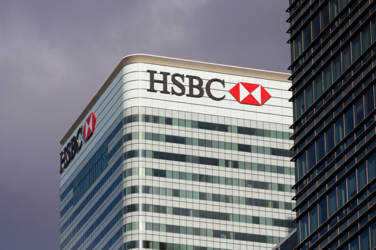 HSBC shares surge after profits triple, quarterly dividend reinstated