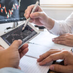 Business,Team,On,Meeting,To,Planning,Investment,Trading,Project,And