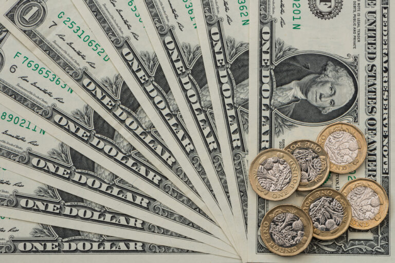 Pound gains against dollar on lower UK inflation