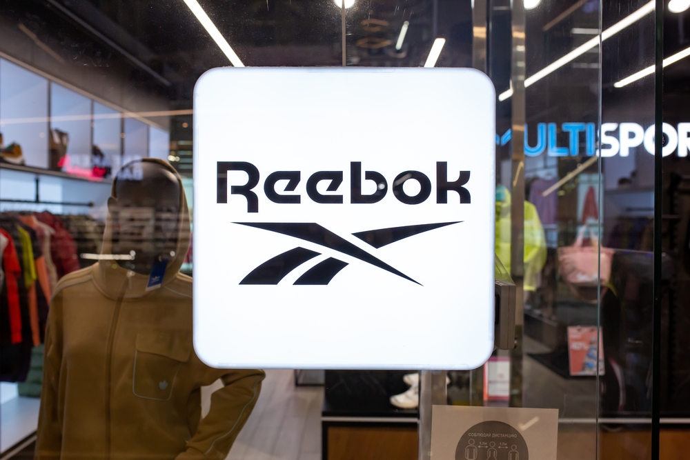 Reebok,Logo.,Reebok,Neon,Sign,In,Shop,Window.,Reebok,Store - Magazine